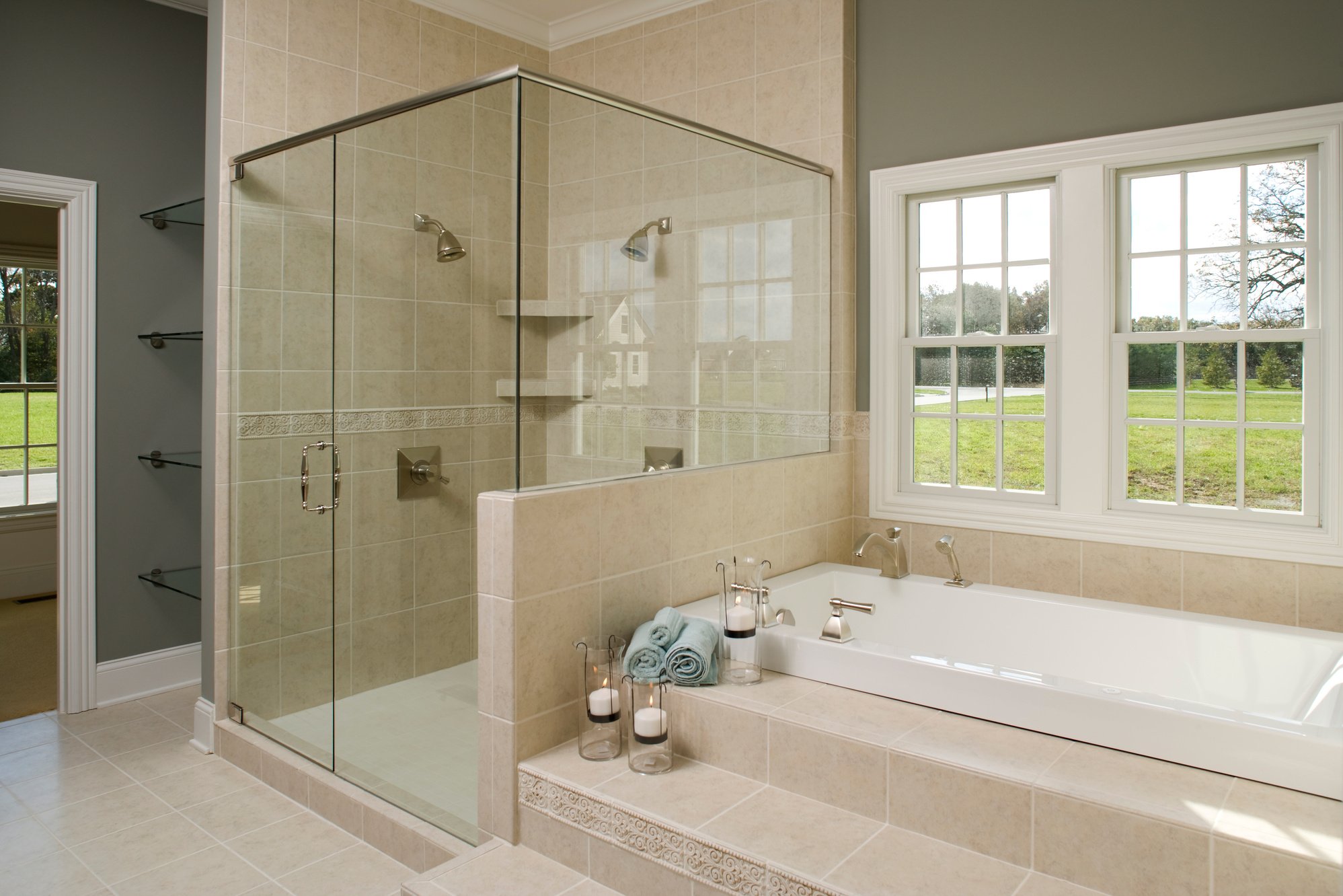 Master bathroom tub and glass shower.