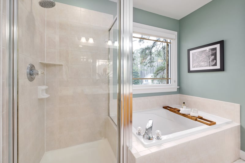 White Ceramic Bathtub Near Shower Screen